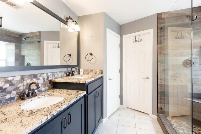 10 Lakewood Cir, Wimberley, TX 78676 - bathroom with a stall shower, two vanities, tile patterned flooring, and decorative backsplash