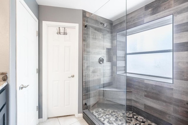 10 Lakewood Cir, Wimberley, TX 78676 - full bath with tiled shower, vanity, and tile patterned flooring
