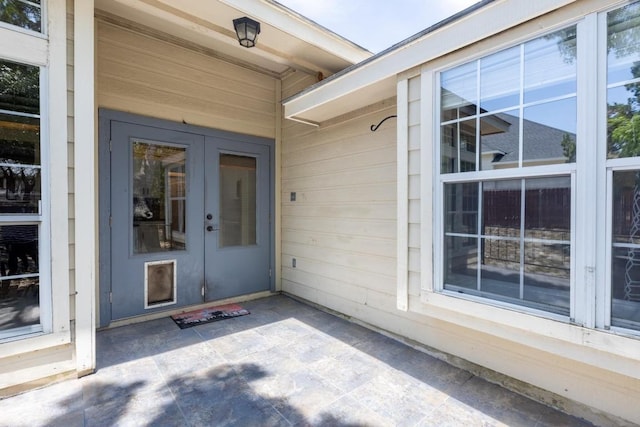 10 Lakewood Cir, Wimberley, TX 78676 - doorway to property featuring french doors and a patio