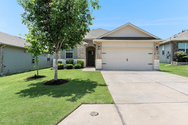 114 Ashford Way, Georgetown, TX 78626 - view of front of home featuring a garage, concrete driveway, a front lawn, and brick siding