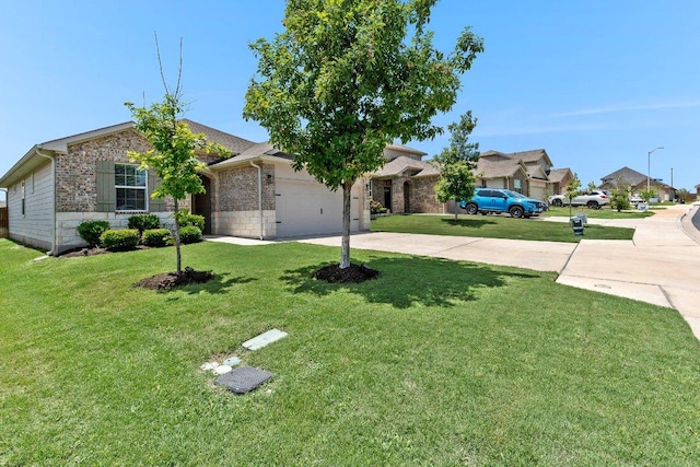 114 Ashford Way, Georgetown, TX 78626 - view of front of home with concrete driveway, a garage, a front yard, and a residential view