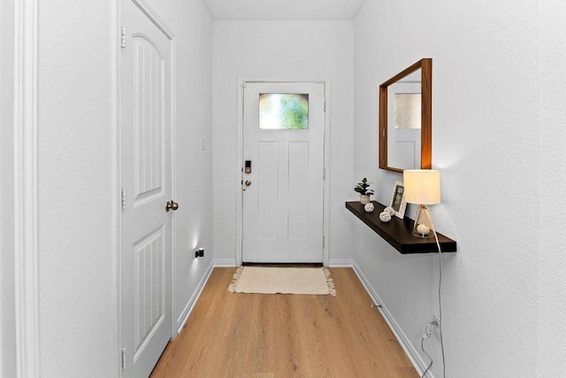 114 Ashford Way, Georgetown, TX 78626 - entryway with light wood-style flooring and baseboards