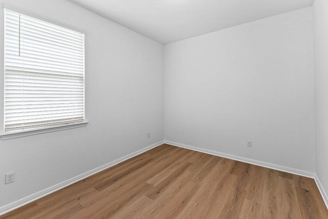 114 Ashford Way, Georgetown, TX 78626 - spare room featuring wood finished floors and baseboards