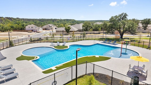 114 Ashford Way, Georgetown, TX 78626 - community pool with a patio and a residential view