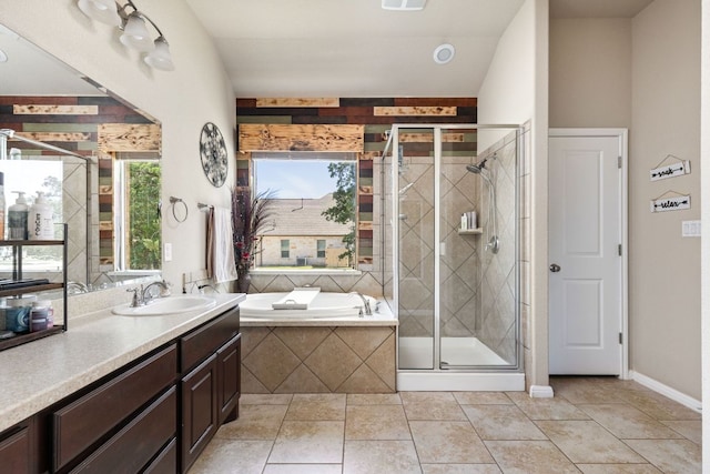 142 Abamillo Dr, Bastrop, TX 78602 - full bath with a garden tub, vanity, a stall shower, and tile patterned floors