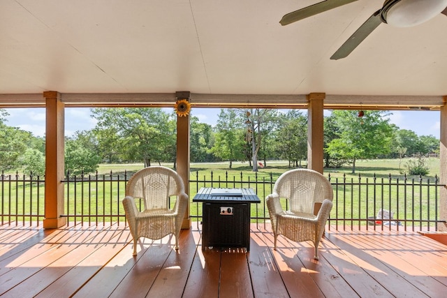 142 Abamillo Dr, Bastrop, TX 78602 - wooden deck featuring a ceiling fan and view of scattered trees