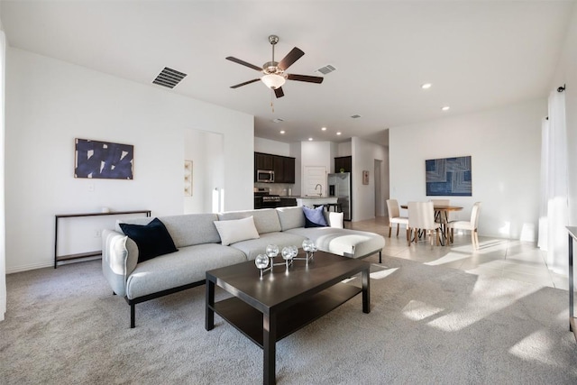 13002 Stanford Dr Unit 40, Austin, TX 78748 - living area with a ceiling fan, light carpet, recessed lighting, and baseboards