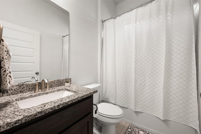 13002 Stanford Dr Unit 40, Austin, TX 78748 - bathroom featuring vanity, toilet, shower / tub combo, and tile patterned floors