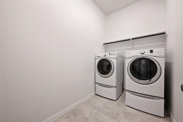 13002 Stanford Dr Unit 40, Austin, TX 78748 - washroom with washing machine and clothes dryer and baseboards