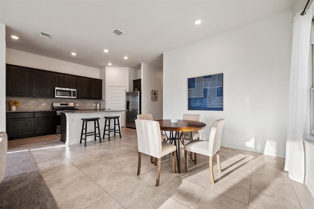 13002 Stanford Dr Unit 40, Austin, TX 78748 - dining space featuring light tile patterned floors and recessed lighting