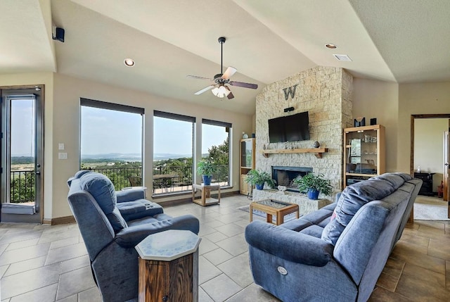 21012 N Rdg, Lago Vista, TX 78645 - living room with ceiling fan, lofted ceiling, and a fireplace