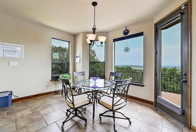21012 N Rdg, Lago Vista, TX 78645 - dining room featuring baseboards and a chandelier