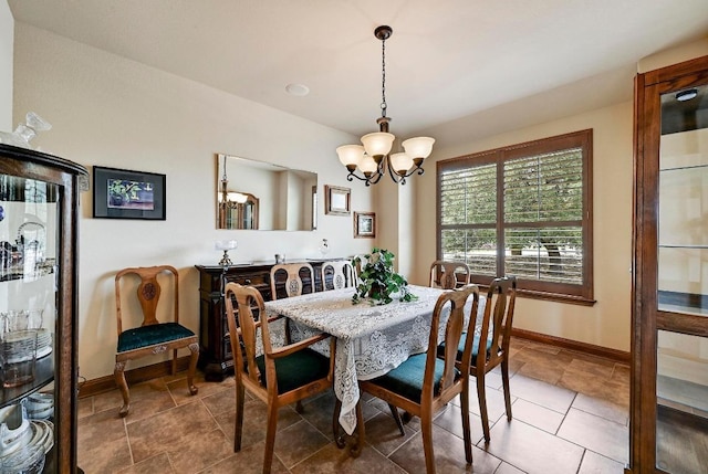 21012 N Rdg, Lago Vista, TX 78645 - dining space with a chandelier and baseboards