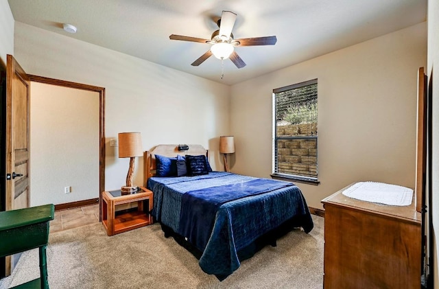 21012 N Rdg, Lago Vista, TX 78645 - bedroom featuring light carpet, baseboards, and a ceiling fan