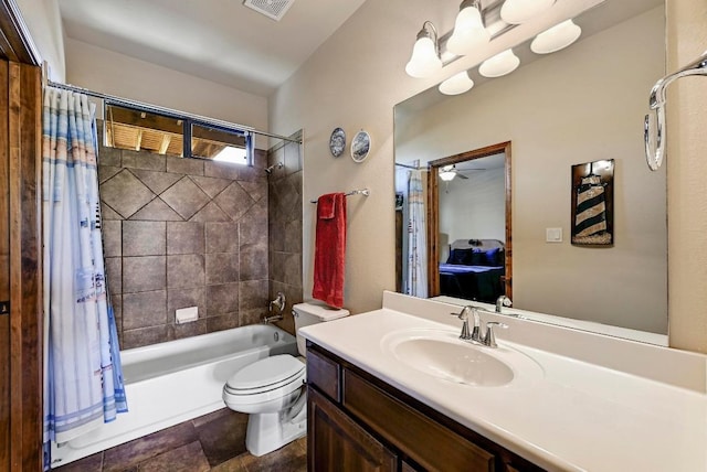 21012 N Rdg, Lago Vista, TX 78645 - bathroom with shower / tub combo, vanity, toilet, and ceiling fan