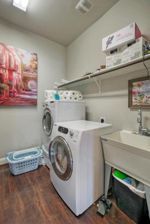 20304 Thumper Jack Ct, Pflugerville, TX 78660 - laundry room featuring independent washer and dryer and wood finished floors