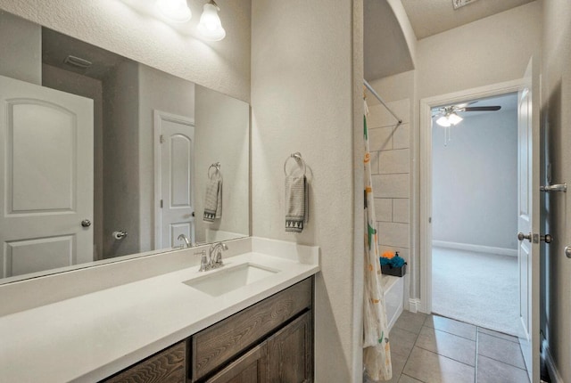 20304 Thumper Jack Ct, Pflugerville, TX 78660 - bathroom with vanity, ceiling fan, shower / bathtub combination with curtain, tile patterned floors, and baseboards