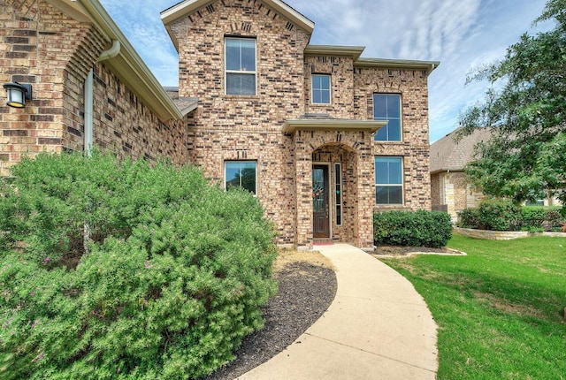 20304 Thumper Jack Ct, Pflugerville, TX 78660 - traditional-style home featuring brick siding and a front yard