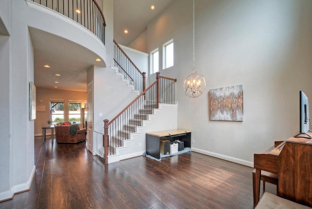 20304 Thumper Jack Ct, Pflugerville, TX 78660 - stairs featuring a high ceiling, wood finished floors, baseboards, a chandelier, and recessed lighting
