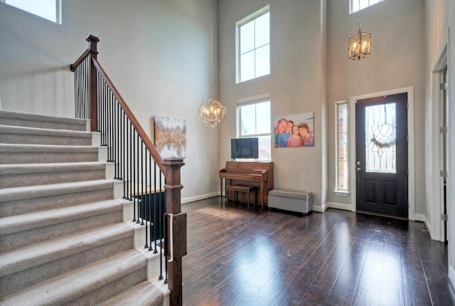 20304 Thumper Jack Ct, Pflugerville, TX 78660 - entryway featuring a chandelier, healthy amount of natural light, a high ceiling, and stairs