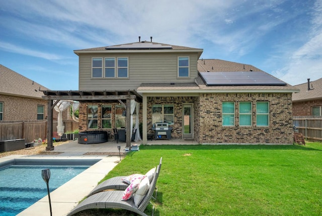 20304 Thumper Jack Ct, Pflugerville, TX 78660 - rear view of property with solar panels, a pergola, a patio area, and brick siding