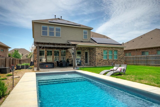20304 Thumper Jack Ct, Pflugerville, TX 78660 - back of property with solar panels, a patio, and brick siding