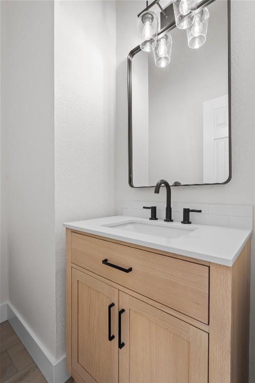 206 High Plains Dr, Dripping Springs, TX 78620 - bathroom featuring vanity and baseboards