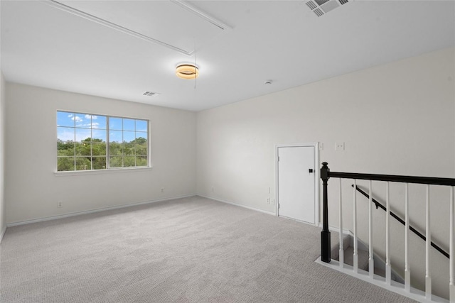 206 High Plains Dr, Dripping Springs, TX 78620 - spare room featuring attic access, carpet flooring, and baseboards