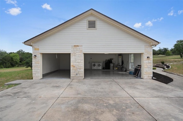206 High Plains Dr, Dripping Springs, TX 78620 - garage featuring separate washer and dryer and gas water heater