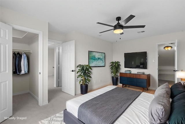 206 High Plains Dr, Dripping Springs, TX 78620 - bedroom featuring baseboards, a closet, light carpet, and ceiling fan