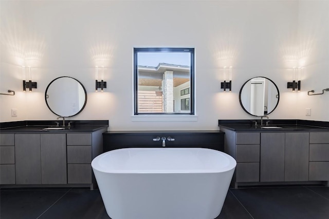 125 Azalea Loop, Horseshoe Bay, TX 78657 - full bathroom with a soaking tub, tile patterned floors, and two vanities