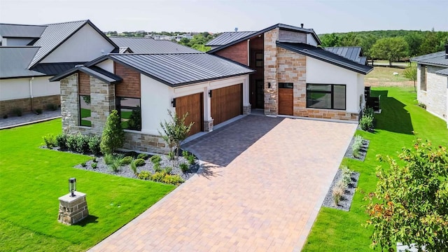 125 Azalea Loop, Horseshoe Bay, TX 78657 - modern home featuring a standing seam roof, stone siding, a garage, metal roof, and stucco siding