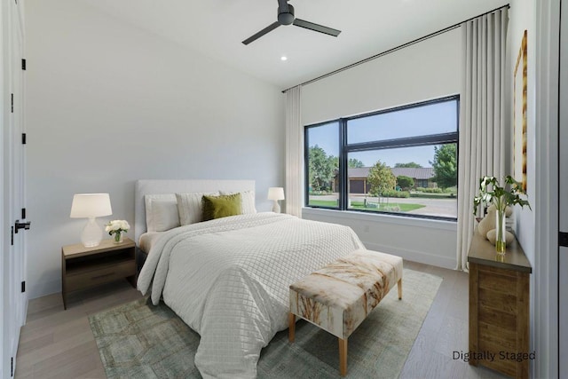 125 Azalea Loop, Horseshoe Bay, TX 78657 - bedroom featuring light wood-style floors, recessed lighting, and a ceiling fan