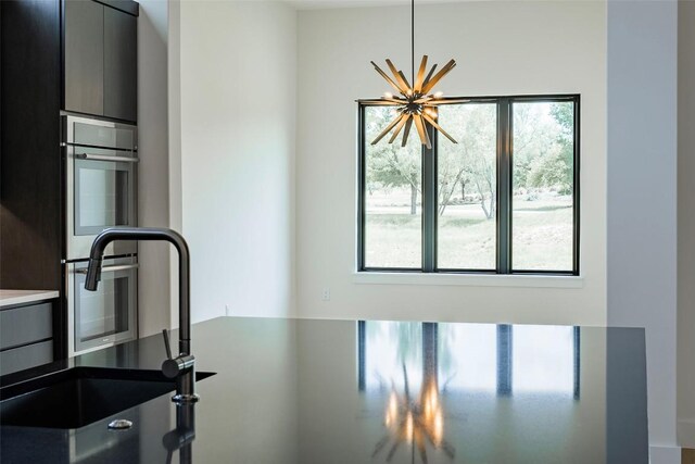 125 Azalea Loop, Horseshoe Bay, TX 78657 - kitchen with double oven, a sink, modern cabinets, and gray cabinetry