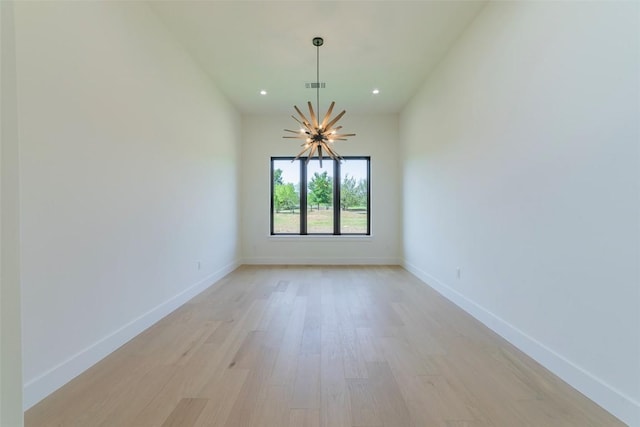 125 Azalea Loop, Horseshoe Bay, TX 78657 - unfurnished room with a chandelier, light wood-type flooring, baseboards, and recessed lighting