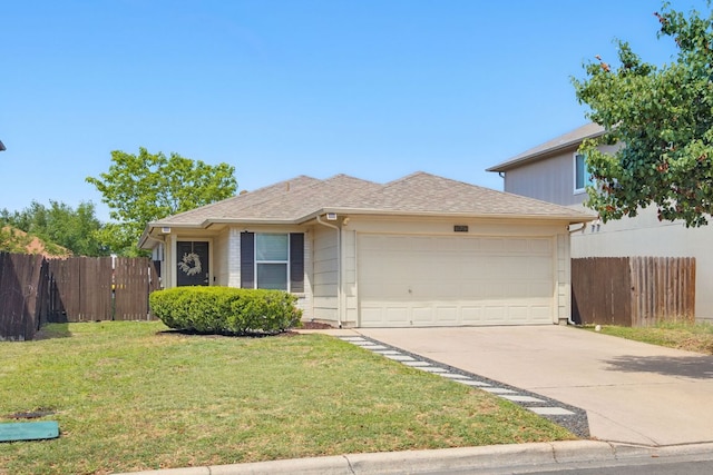 16708 Hamilton Point Cir, Manor, TX 78653 - view of front of home with an attached garage, concrete driveway, and a shingled roof