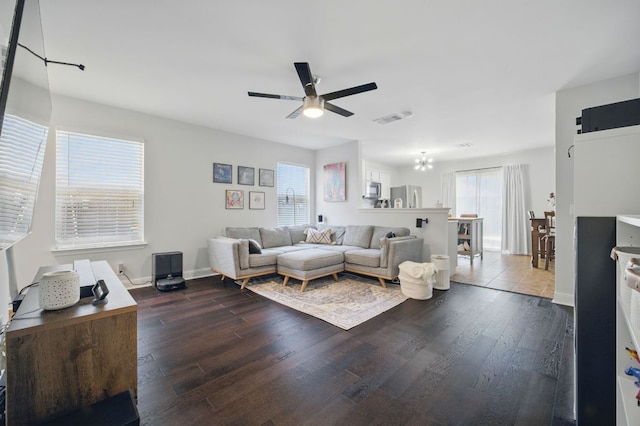 16708 Hamilton Point Cir, Manor, TX 78653 - living area featuring a ceiling fan, wood finished floors, and baseboards