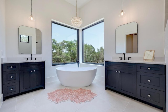 4255 Fm 3405, Georgetown, TX 78633 - full bath with two vanities, a soaking tub, and tile patterned floors