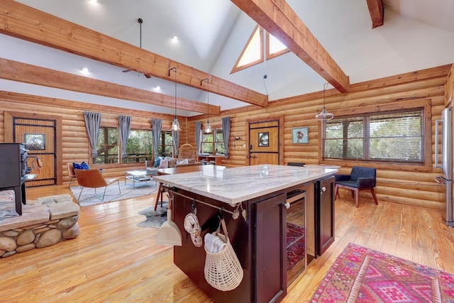 4255 Fm 3405, Georgetown, TX 78633 - recreation room featuring log walls, high vaulted ceiling, light wood-style floors, beam ceiling, and wine cooler