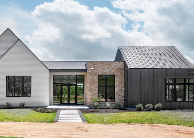 4255 Fm 3405, Georgetown, TX 78633 - view of front of house featuring board and batten siding, a metal roof, and a standing seam roof