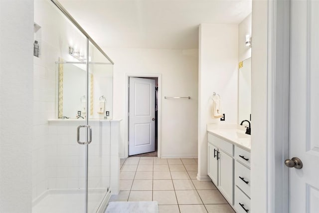 241 Oleander Loop, Buda, TX 78610 - full bath with a stall shower, vanity, tile patterned flooring, and baseboards