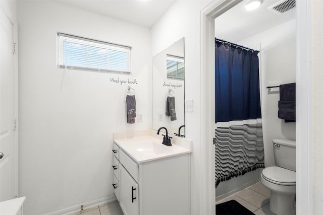 241 Oleander Loop, Buda, TX 78610 - full bath featuring tile patterned floors, vanity, toilet, curtained shower, and baseboards
