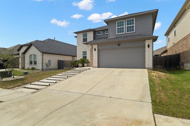 241 Oleander Loop, Buda, TX 78610 - traditional-style house featuring brick siding, driveway, and an attached garage