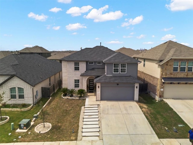 241 Oleander Loop, Buda, TX 78610 - traditional-style home featuring brick siding, concrete driveway, a garage, a front lawn, and a shingled roof