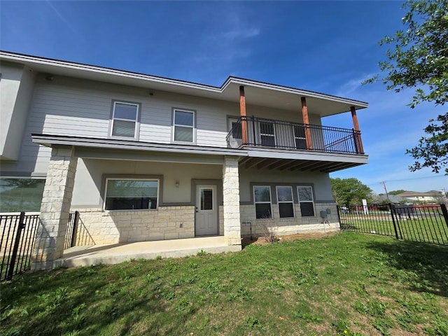 2105 Tiger Trl Unit 101, Round Rock, TX 78665 - view of front of property featuring a balcony, stucco siding, and stone siding