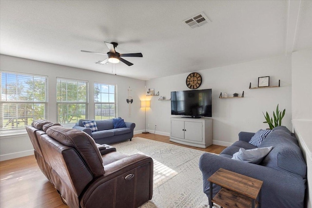 100 N Prairie Ln, Georgetown, TX 78633 - living area with a ceiling fan, baseboards, and light wood-style floors