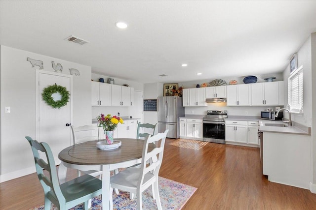100 N Prairie Ln, Georgetown, TX 78633 - dining area with light wood finished floors, recessed lighting, and baseboards