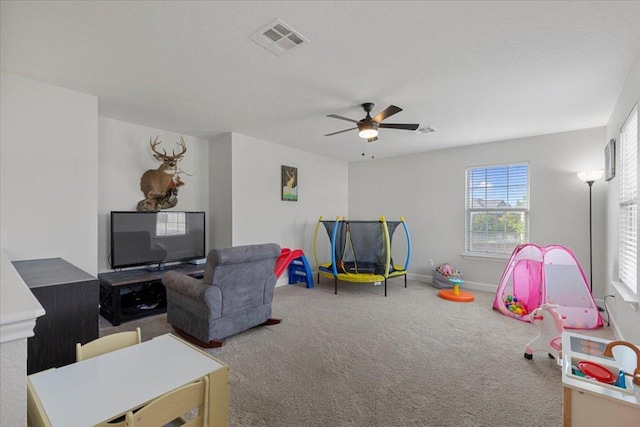 100 N Prairie Ln, Georgetown, TX 78633 - playroom with carpet flooring, a ceiling fan, and baseboards