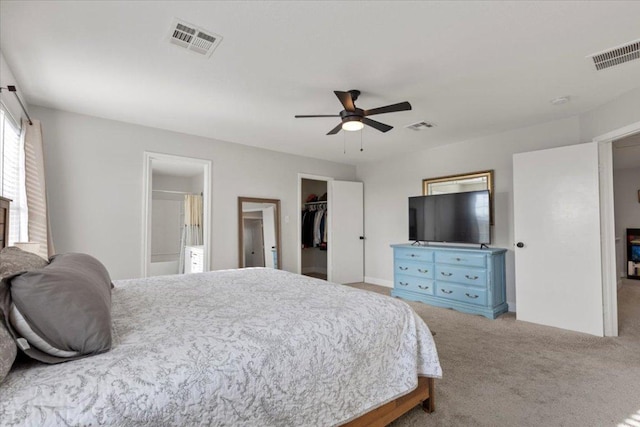 100 N Prairie Ln, Georgetown, TX 78633 - bedroom with carpet, a walk in closet, a closet, a ceiling fan, and ensuite bath