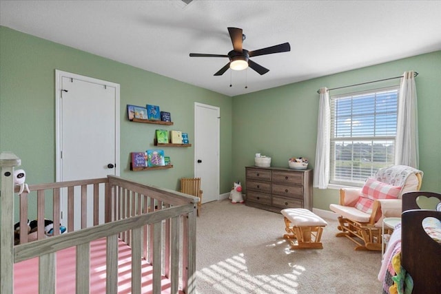 100 N Prairie Ln, Georgetown, TX 78633 - bedroom featuring a crib, carpet floors, and a ceiling fan